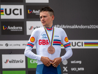 Thomas Pidcock of Great Britain stands on the podium at the UCI Mountain Bike World Championships Men Under 23 Race in Pal Arinsal, Andorra,...