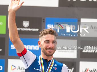 Victor Koretzky of France stands on the podium at the UCI Mountain Bike World Championships Men Under 23 Race in Pal Arinsal, Andorra, on Se...