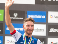 Victor Koretzky of France stands on the podium at the UCI Mountain Bike World Championships Men Under 23 Race in Pal Arinsal, Andorra, on Se...