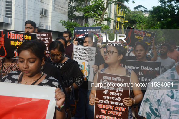 Activists of the women's organization named 'Night is Ours' protest during a nationwide strike by doctors to condemn the rape and murder of...