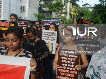 Activists of the women's organization named 'Night is Ours' protest during a nationwide strike by doctors to condemn the rape and murder of...