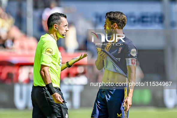 Referee Dennis Higler and FC Twente player Ricky van Wolfswinkel during the match between Utrecht and Twente at Stadium Galgenwaard for the...