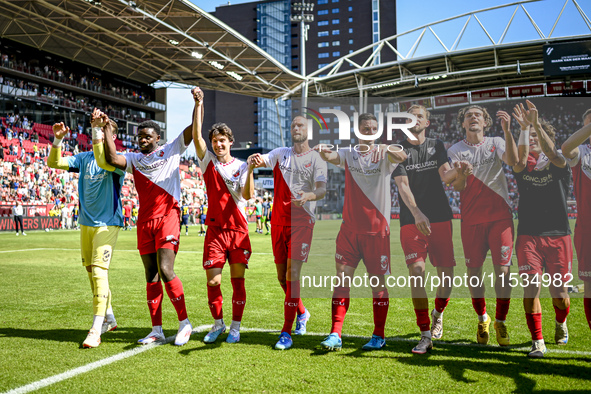 FC Utrecht players Noah Ohio, Paxten Aaronson, Mike van der Hoorn, Nick Viergever, and Anthony Descotte celebrate the win during the match b...