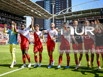 FC Utrecht players Noah Ohio, Paxten Aaronson, Mike van der Hoorn, Nick Viergever, and Anthony Descotte celebrate the win during the match b...