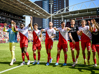 FC Utrecht players Noah Ohio, Paxten Aaronson, Mike van der Hoorn, Nick Viergever, and Anthony Descotte celebrate the win during the match b...