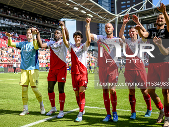 FC Utrecht players Noah Ohio, Paxten Aaronson, Mike van der Hoorn, and Nick Viergever celebrate the win during the match between Utrecht and...