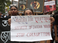 Ramakrishna Mission alumni and office staff take part in a protest march against a doctor's rape and murder in Kolkata, India, on September...