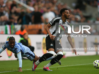 Newcastle United's Lloyd Kelly turns against Tottenham Hotspur's Wilson Odobert during the Premier League match between Newcastle United and...