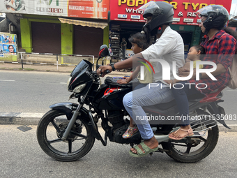 A family travels on a motorbike in Thiruvananthapuram (Trivandrum), Kerala, India, on April 2, 2024. (