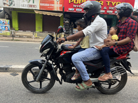 A family travels on a motorbike in Thiruvananthapuram (Trivandrum), Kerala, India, on April 2, 2024. (