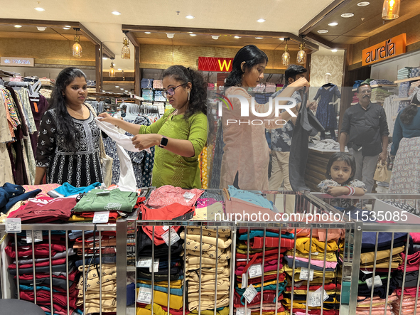 Women shop for churidars at a textile shop in Thiruvananthapuram, Kerala, India, on April 10, 2024. 