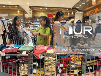 Women shop for churidars at a textile shop in Thiruvananthapuram, Kerala, India, on April 10, 2024. (