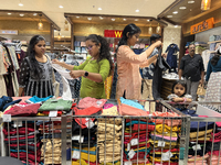 Women shop for churidars at a textile shop in Thiruvananthapuram, Kerala, India, on April 10, 2024. (