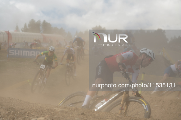 Cyclists participate in the UCI Mountain Bike World Championships Men in Pal Arinsal, Andorra, on September 1, 2024. 