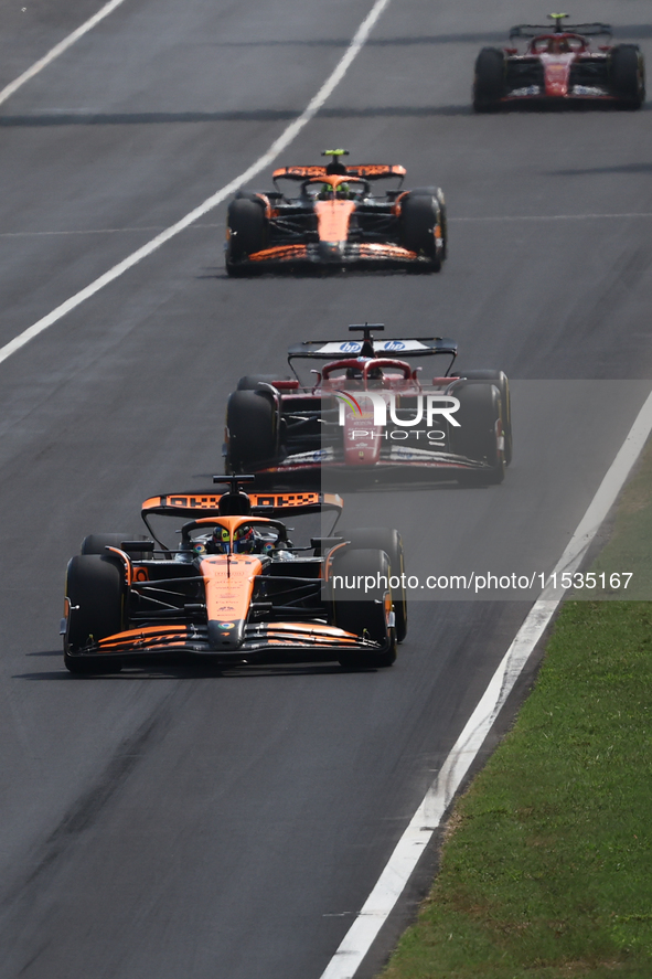 Oscar Piastri of McLaren, Charles Leclerc of Ferrari, Lando Norris of McLaren and Carlos Sainz of Ferrari during the Formula 1 Italian Grand...