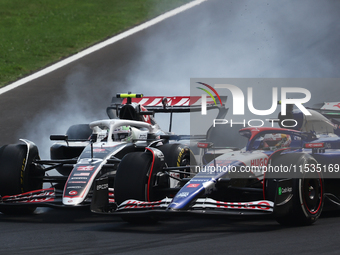 Nico Hulkenberg of Haas and Yuki Tsunoda of RB during the Formula 1 Italian Grand Prix at Autodromo Nazionale di Monza in Monza, Italy on Se...