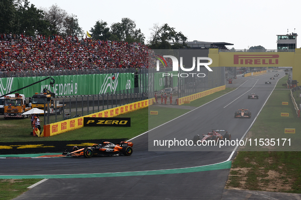 Oscar Piastri of McLaren, Charles Leclerc of Ferrari, Lando Norris of McLaren and Carlos Sainz of Ferrari during the Formula 1 Italian Grand...