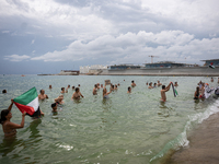 Dozens of activists participate in the international initiative ''Swim With Gaza'' on Nova Icaria beach, in Barcelona, Spain, on September 1...