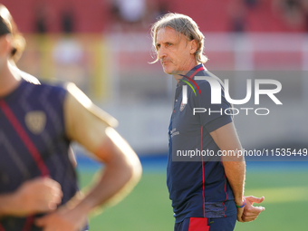 Davide Nicola, head coach of Cagliari Calcio, watches the Serie A match between Lecce and Cagliari in Lecce, Italy, on August 31, 2024. (