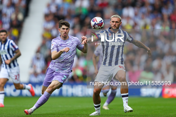 John Swift of West Bromwich (R) and Joshua Key of Swansea are in action during the Sky Bet Championship match between West Bromwich Albion a...