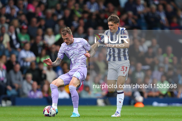 Josh Tymon of Swansea (L) and Tom Fellows of West Bromwich compete during the Sky Bet Championship match between West Bromwich Albion and Sw...