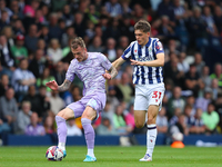 Josh Tymon of Swansea (L) and Tom Fellows of West Bromwich compete during the Sky Bet Championship match between West Bromwich Albion and Sw...