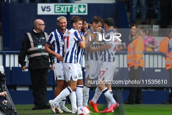 Jayson Molumby of West Bromwich celebrates with his teammates after scoring his team's first goal during the Sky Bet Championship match betw...