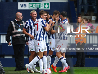 Jayson Molumby of West Bromwich celebrates with his teammates after scoring his team's first goal during the Sky Bet Championship match betw...