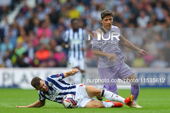 Jayson Molumby of West Bromwich (L) in action with Goncalo Franco of Swansea during the Sky Bet Championship match between West Bromwich Alb...