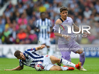 Jayson Molumby of West Bromwich (L) in action with Goncalo Franco of Swansea during the Sky Bet Championship match between West Bromwich Alb...