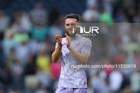 Swansea City's Matt Grimes applauds their fans at the end of the Sky Bet Championship match between West Bromwich Albion and Swansea City at...