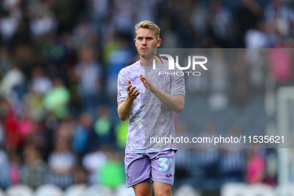 Swansea City's Oli Cooper applauds their fans at the end of the Sky Bet Championship match between West Bromwich Albion and Swansea City at...