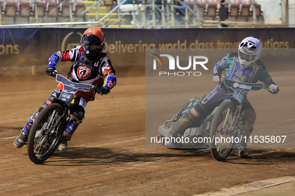 Joe Thompson (Guest) of Belle Vue 'Cool Running' Colts tussles with Mason Watson of Edinburgh Monarchs Academy during the WSRA National Deve...