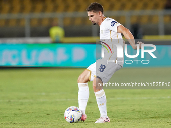 Razvan Marin of Cagliari Calcio is in action during the Serie A match between Lecce and Cagliari in Lecce, Italy, on August 31, 2024. (