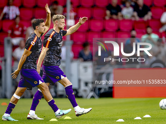 The Go Ahead Eagles warm up during the match PSV vs. Go Ahead Eagles at the Philips Stadium for the Dutch Eredivisie 4th round season 2024-2...