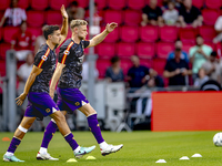 The Go Ahead Eagles warm up during the match PSV vs. Go Ahead Eagles at the Philips Stadium for the Dutch Eredivisie 4th round season 2024-2...