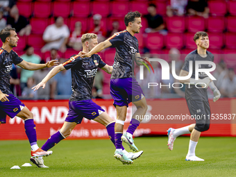 The Go Ahead Eagles warm up during the match PSV vs. Go Ahead Eagles at the Philips Stadium for the Dutch Eredivisie 4th round season 2024-2...