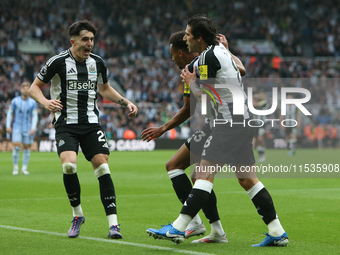 Tino Livramento of Newcastle United celebrates Alexander Isak's goal with Jacob Murphy and Sandro Tonali of Newcastle United during the Prem...