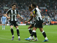 Tino Livramento of Newcastle United celebrates Alexander Isak's goal with Jacob Murphy and Sandro Tonali of Newcastle United during the Prem...