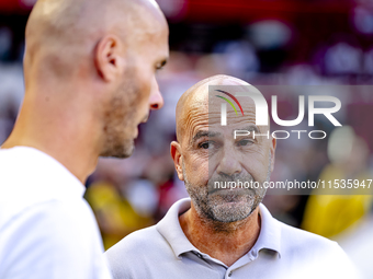 PSV trainer Peter Bosz and Go Ahead Eagles trainer Paul Simonis during the match between PSV and Go Ahead Eagles at the Philips Stadium for...