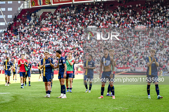 Players of FC Twente are disappointed after the match. FC Twente player Sem Steijn, FC Twente player Daan Rots, and FC Twente player Mees Hi...