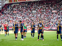 Players of FC Twente are disappointed after the match. FC Twente player Sem Steijn, FC Twente player Daan Rots, and FC Twente player Mees Hi...