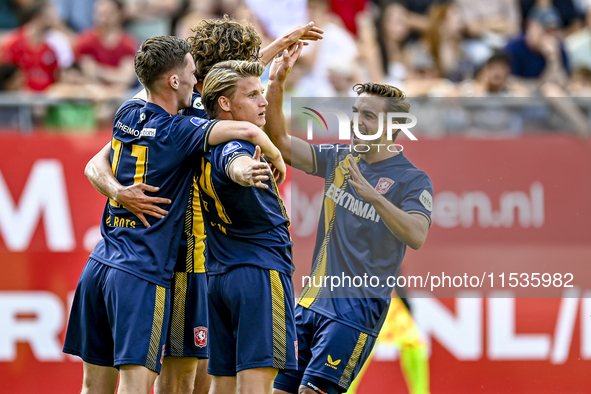 FC Twente players Daan Rots, Sam Lammers, Sem Steijn, and Bart van Rooij celebrate the 0-1 goal during the match between Utrecht and Twente...