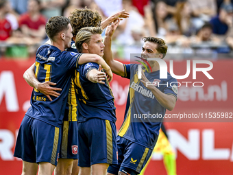 FC Twente players Daan Rots, Sam Lammers, Sem Steijn, and Bart van Rooij celebrate the 0-1 goal during the match between Utrecht and Twente...