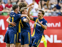 FC Twente players Daan Rots, Sam Lammers, Sem Steijn, and Bart van Rooij celebrate the 0-1 goal during the match between Utrecht and Twente...