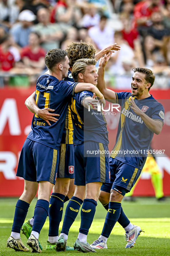 FC Twente players Daan Rots, Sam Lammers, Sem Steijn, and Bart van Rooij celebrate the 0-1 goal during the match between Utrecht and Twente...