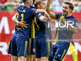 FC Twente players Daan Rots, Sam Lammers, Sem Steijn, and Bart van Rooij celebrate the 0-1 goal during the match between Utrecht and Twente...