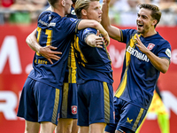 FC Twente players Daan Rots, Sam Lammers, Sem Steijn, and Bart van Rooij celebrate the 0-1 goal during the match between Utrecht and Twente...