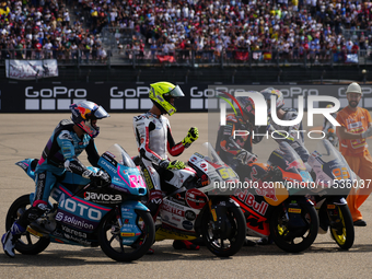 David Alonso (80) of Colombia and CFMoto Gaviota Aspar Team, Luca Lunetta (58) of Italy and Sic58 Squadra Corse Honda, Jose Antonio Rueda (9...