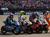 David Alonso (80) of Colombia and CFMoto Gaviota Aspar Team, Luca Lunetta (58) of Italy and Sic58 Squadra Corse Honda, Jose Antonio Rueda (9...